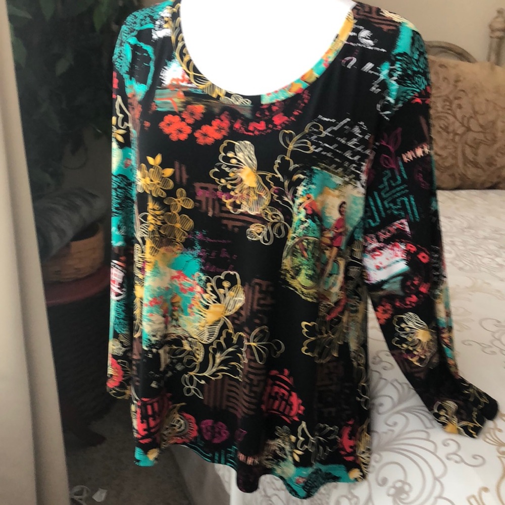Very fun design. Investments polyester 3/4 sleeve women’s top. Size XL